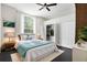 Bedroom with natural light, ceiling fan and built in closet for storage at 12085 Stringer Rd, Brooksville, FL 34601