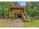 Charming cabin on stilts surrounded by a lush, green landscape at 12085 Stringer Rd, Brooksville, FL 34601