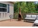 A cozy deck featuring a chiminea, seating, and an outdoor view in a serene and inviting setting at 12085 Stringer Rd, Brooksville, FL 34601