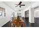 Dining room with table and chairs, built-in shelves, and a view to the screened lanai at 12085 Stringer Rd, Brooksville, FL 34601
