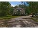 Charming two-story home with a cozy balcony, set back on land with mature trees at 12085 Stringer Rd, Brooksville, FL 34601