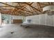 Large unfinished interior featuring exposed wooden beams, natural light, and a spacious layout at 12085 Stringer Rd, Brooksville, FL 34601