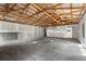 Spacious unfinished interior with exposed beams and drywall, featuring plenty of natural light at 12085 Stringer Rd, Brooksville, FL 34601