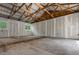 Unfinished interior featuring exposed beams, natural light, and a spacious layout at 12085 Stringer Rd, Brooksville, FL 34601