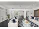 A spacious living room featuring an open layout, a plush couch, modern decor, and natural light at 12085 Stringer Rd, Brooksville, FL 34601