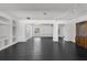Spacious living room with black tile flooring, recessed lights, and decorative built-ins at 12085 Stringer Rd, Brooksville, FL 34601