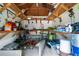 Overstuffed shed with tools, work bench, and shelving for storage at 12085 Stringer Rd, Brooksville, FL 34601