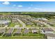 Expansive aerial view of the community showcasing well-maintained homes, lush landscaping, and serene water features at 12313 Criollo Rd, Spring Hill, FL 34610
