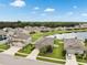 Community aerial view showcasing homes near a scenic lake, perfect for a tranquil residential setting at 12313 Criollo Rd, Spring Hill, FL 34610