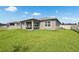 Well-maintained backyard with a covered patio offering ample space for recreation and relaxation at 12313 Criollo Rd, Spring Hill, FL 34610