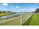 Picturesque backyard view of the community lake providing a serene and peaceful environment at 12313 Criollo Rd, Spring Hill, FL 34610