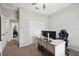 Cozy bedroom with neutral walls, ceiling fan and carpet flooring perfect for a home office or study space at 12313 Criollo Rd, Spring Hill, FL 34610