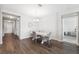 Elegant dining area with a stylish table, chandelier lighting, and neutral colors at 12313 Criollo Rd, Spring Hill, FL 34610