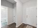Welcoming entryway features a tiled bathroom and neutral decor at 12313 Criollo Rd, Spring Hill, FL 34610