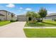 Charming single-Gathering home with a manicured lawn, mature trees, and a welcoming two-car garage at 12313 Criollo Rd, Spring Hill, FL 34610