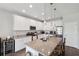 Bright kitchen showcases granite counters, stainless appliances, subway tile, and center island with sink and seating at 12313 Criollo Rd, Spring Hill, FL 34610