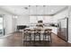 Modern open kitchen with a large island, stainless steel appliances, and ample counter space at 12313 Criollo Rd, Spring Hill, FL 34610