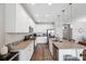 Bright kitchen with granite countertops, stainless appliances, and large island with sink and bar seating at 12313 Criollo Rd, Spring Hill, FL 34610