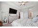Comfortable main bedroom features neutral color palette, trey ceiling, and ensuite bathroom access at 12313 Criollo Rd, Spring Hill, FL 34610