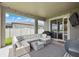Covered patio featuring a stylish outdoor seating area, perfect for entertaining or relaxing while enjoying the outdoors at 12313 Criollo Rd, Spring Hill, FL 34610