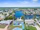 Aerial view of the home on the water with a long dock, and waterfront access at 12535 Third Isle, Hudson, FL 34667