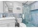 Modern bathroom features sleek vanity, toilet and glass-enclosed shower at 12535 Third Isle, Hudson, FL 34667