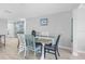 Dining room features a table set for six, with decor accents and beach-themed art at 12535 Third Isle, Hudson, FL 34667