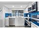 Modern kitchen featuring white cabinets and stainless steel appliances at 12535 Third Isle, Hudson, FL 34667