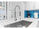 Close-up of a modern kitchen sink with a stainless steel faucet at 12535 Third Isle, Hudson, FL 34667