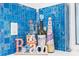 Artistic bottles displayed on blue tile countertop at 12535 Third Isle, Hudson, FL 34667