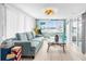 Cozy living room with a comfortable sofa, views of the water, and sliding glass doors at 12535 Third Isle, Hudson, FL 34667
