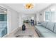 Open-concept layout with a living room flowing into the dining area and kitchen, perfect for entertaining at 12535 Third Isle, Hudson, FL 34667