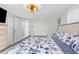 Spacious bedroom with coastal-themed bedding, bright lighting and ample storage at 12535 Third Isle, Hudson, FL 34667