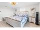 Bright bedroom with coastal decor, comfortable bed, and plenty of natural light at 12535 Third Isle, Hudson, FL 34667