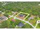 Aerial shot of a house and neighborhood, with a yard outlined in yellow at 128 Oak Lake Dr, Spring Hill, FL 34608