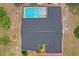 Aerial view showcasing a screened in pool and dark roof at 128 Oak Lake Dr, Spring Hill, FL 34608