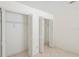 White closet with bi-fold doors and ample storage and wire shelving at 128 Oak Lake Dr, Spring Hill, FL 34608