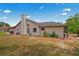 The exterior of this home features a brick chimney, nice landscaping, and a classic suburban design at 128 Oak Lake Dr, Spring Hill, FL 34608
