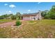 This home features a spacious two-car garage, well-manicured lawn, and a classic suburban design at 128 Oak Lake Dr, Spring Hill, FL 34608
