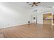 Spacious living room with vaulted ceilings, hardwood floors, and easy kitchen access at 128 Oak Lake Dr, Spring Hill, FL 34608