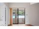 Sliding doors in the living room provide a clear view and access to the outdoor pool area at 128 Oak Lake Dr, Spring Hill, FL 34608