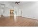 Open-concept living room featuring hardwood floors, kitchen, and sliding glass doors at 128 Oak Lake Dr, Spring Hill, FL 34608