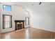 Bright living room with vaulted ceiling and fireplace, plus two windows at 128 Oak Lake Dr, Spring Hill, FL 34608
