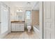 A bright bathroom features tile floors, a shower-tub, and ample counter space at 12805 Coronado Dr, Spring Hill, FL 34609