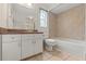 Bright bathroom featuring tile floors, shower-tub, and ample counter space at 12805 Coronado Dr, Spring Hill, FL 34609