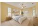 Inviting main bedroom with a comfortable bed, soft lighting, and serene decor for a relaxing retreat at 12805 Coronado Dr, Spring Hill, FL 34609
