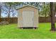 Exterior shot of shed with neutral siding and a simple, functional design at 12805 Coronado Dr, Spring Hill, FL 34609