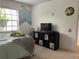 Bedroom featuring a bed, TV, and ocean-themed decor, creating a playful atmosphere at 13316 Brigham Ln, Hudson, FL 34667