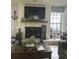 Comfortable living room with fireplace, modern décor, and a cozy atmosphere at 13316 Brigham Ln, Hudson, FL 34667