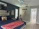 Comfortable main bedroom featuring stylish décor, a ceiling fan, and tile flooring at 13316 Brigham Ln, Hudson, FL 34667
